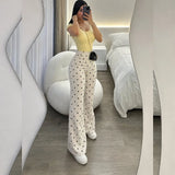 Conjunto Luciana amarillo con blusa ajustada y pantalón palazzo de lunares en scuba | MATTEA